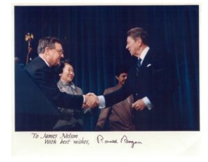 Soo Fouts with President Ronald Regan and Judge James Nelson